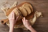 1793198392_top-view-woman-cutting-bread-Depositphotos_271250834_S-1-.jpg