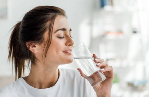 1792842221_smiling-girl-holding-drinking-water-Depositphotos_312329938_S.jpg