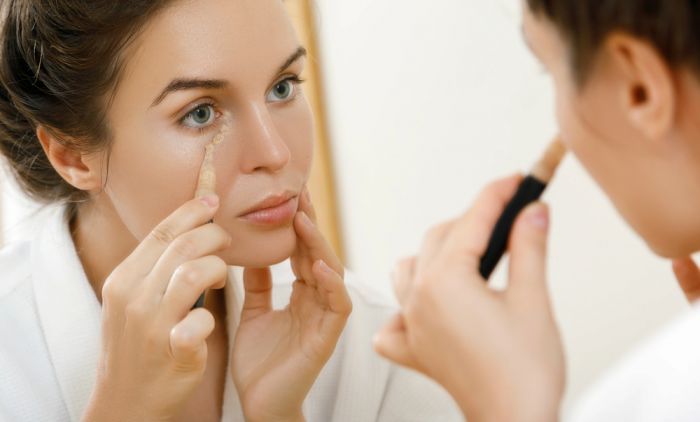 1793184639_woman-using-concealer-eye-circles-Depositphotos_203222900_S.jpg