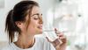 1792842221_smiling-girl-holding-drinking-water-Depositphotos_312329938_S.jpg
