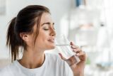 1792842221_smiling-girl-holding-drinking-water-Depositphotos_312329938_S.jpg
