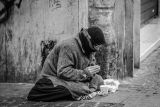 1595494816_grayscale-photography-of-man-praying-on-sidewalk-with-food-1058068.jpg