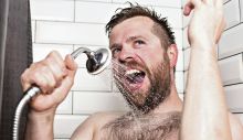1702205066_1928785_stockphotocutebeardedmansinginginthebathroomusingtheshowerheadwithflowingwaterinsteadofa1149584657_ff.jpg